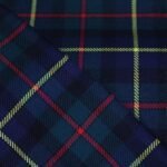 Premium navy and green yarn dyed flannel bedding fabric with yellow and red stripes